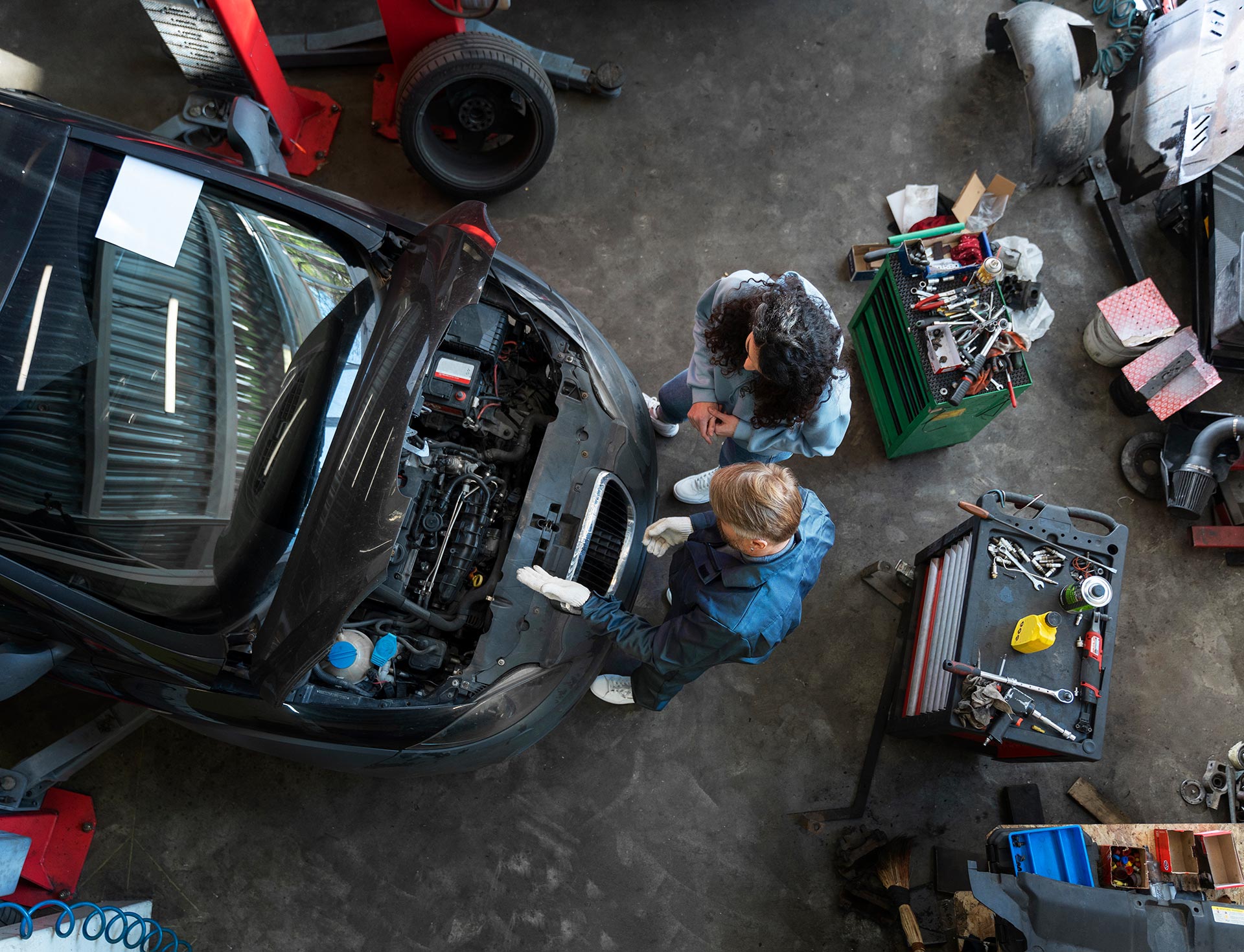 top-view-man-repairing-car